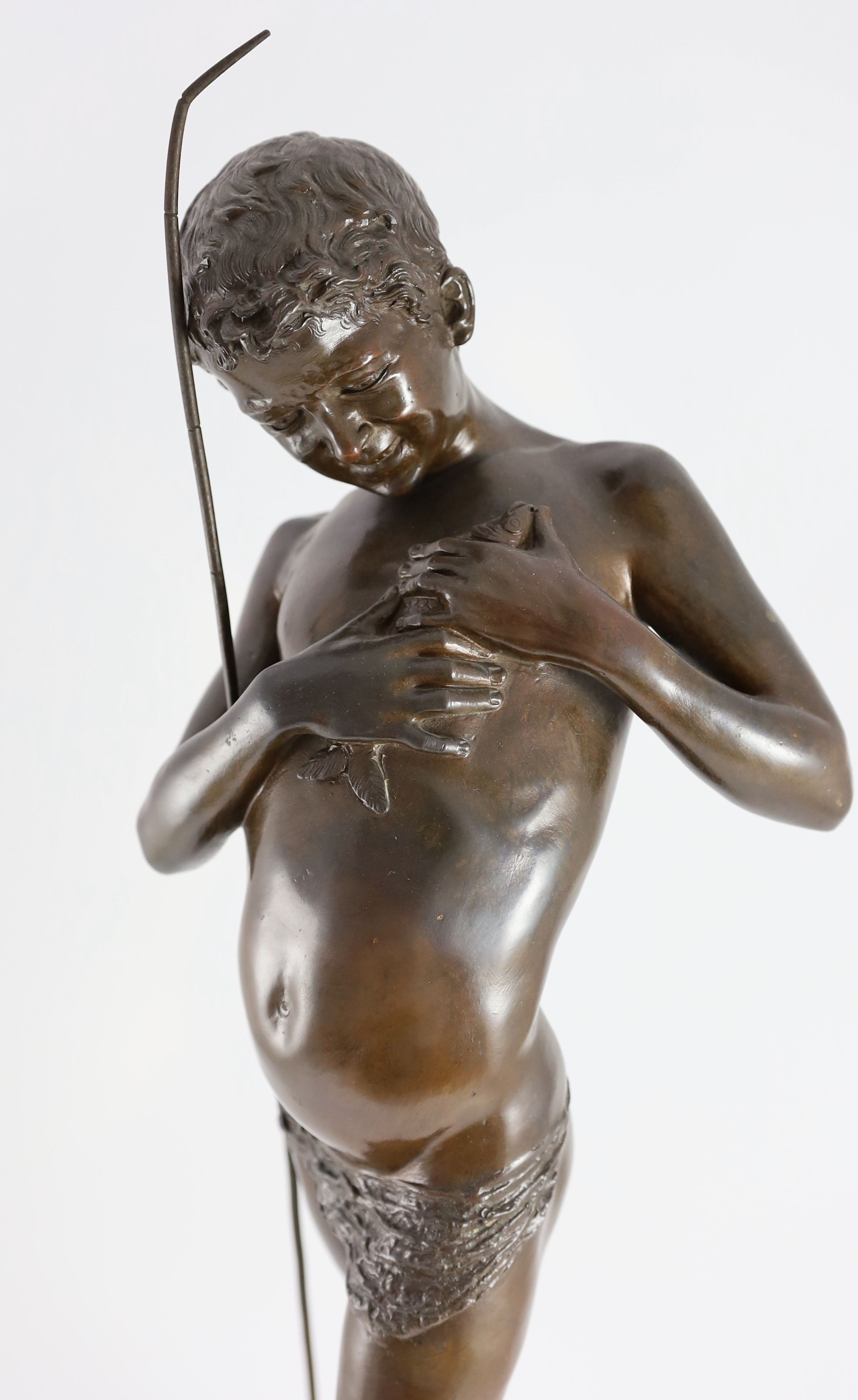 Giovanni Varlese (Italian, 1888-1922). A bronze figure of a fisherboy standing holding a fish to his chest, height 72cm